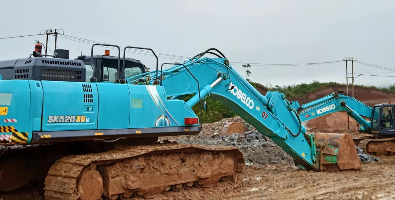 Excavators Working on Wet Sand