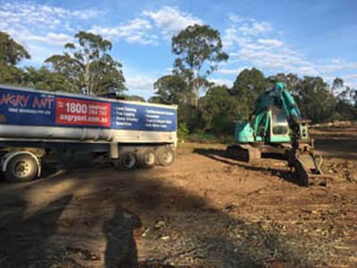 backhoe used in land clearing
